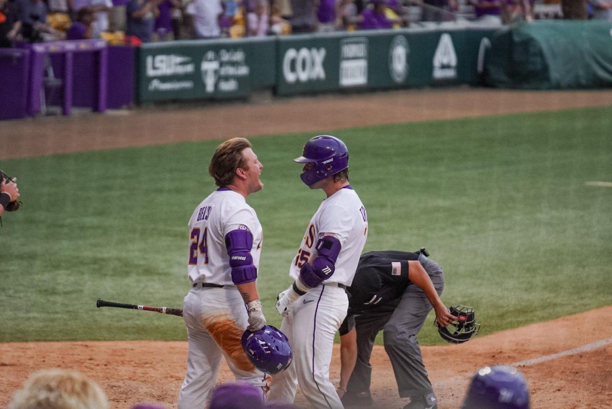 LSU baseball redshirt junior catcher Hayden Travinski (15) celebrates a home run with baseball graduate student designated hitter Cade Beloso (24) Sunday, June 4, 2023, during LSU&#8217;s 6-5 win against Oregon State at Alex Box Stadium in Baton Rouge, La.