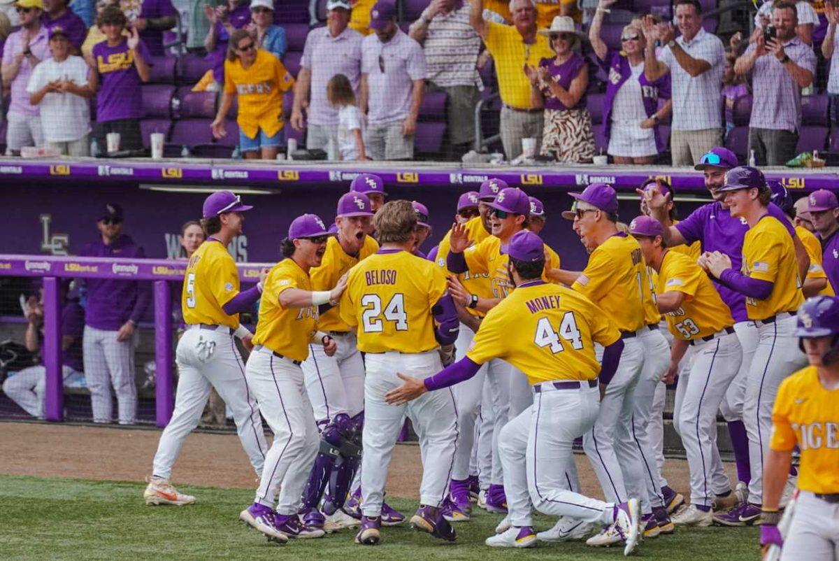 LSU baseball graduate student designated hitter Cade Beloso (24) celebrates a home run with teammates Monday, June 5, 2023, during LSU&#8217;s 13-7 win against Oregon state in Alex Box Stadium in Baton Rouge, La.