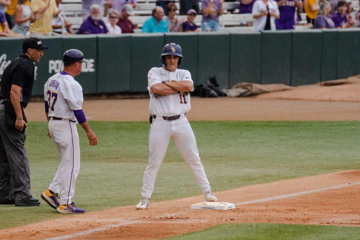 LSU baseball sophomore outfielder Josh Pearson (11) crosses his arms after running to third base Sunday, June 4, 2023, during LSU&#8217;s 6-5 win against Oregon State at Alex Box Stadium in Baton Rouge, La.