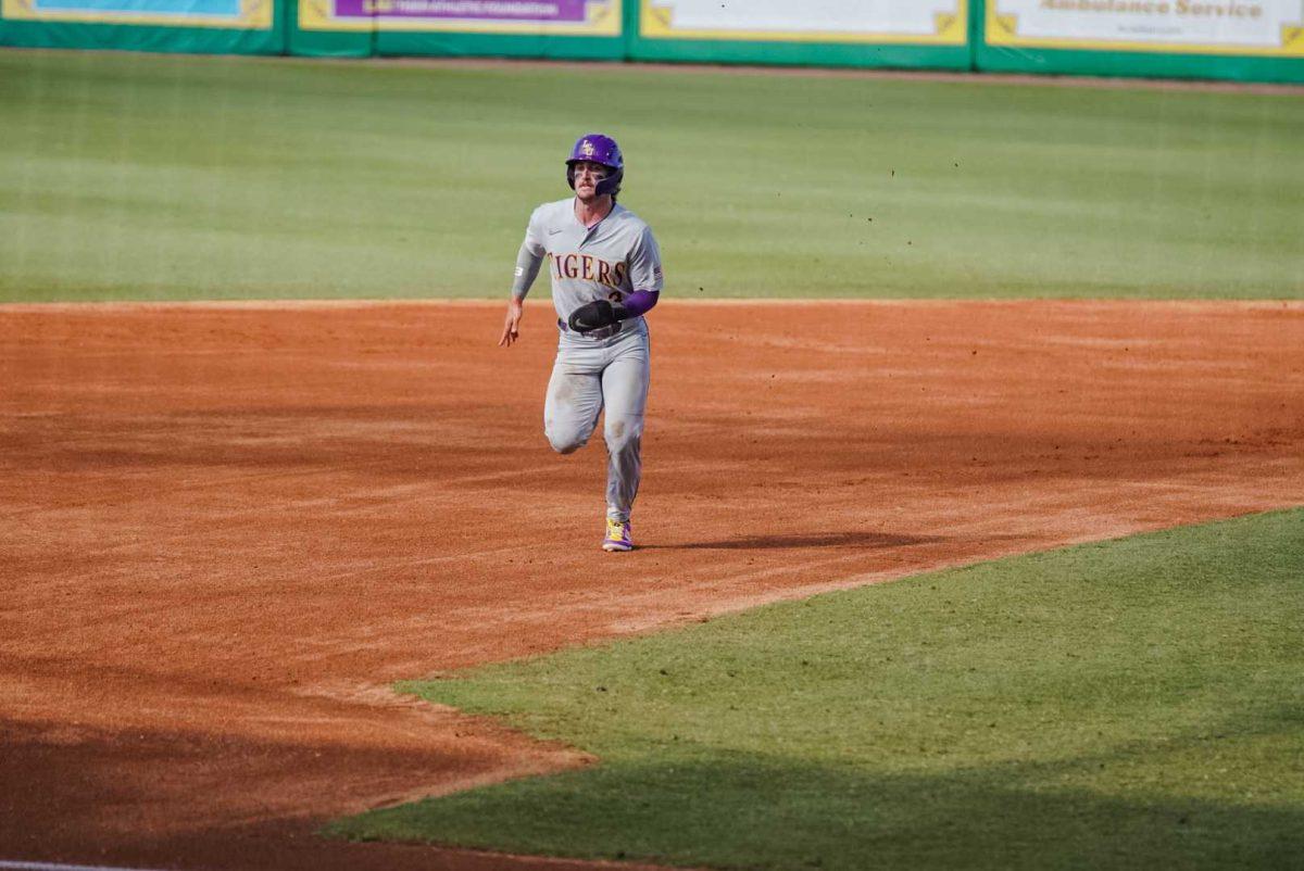 LSU baseball junior outfielder Dylan Crews (3) runs to third base Sunday, June 11, 2023, during LSU&#8217;s 8-3 win against Kentucky at Alex Box Stadium in Baton Rouge, La.