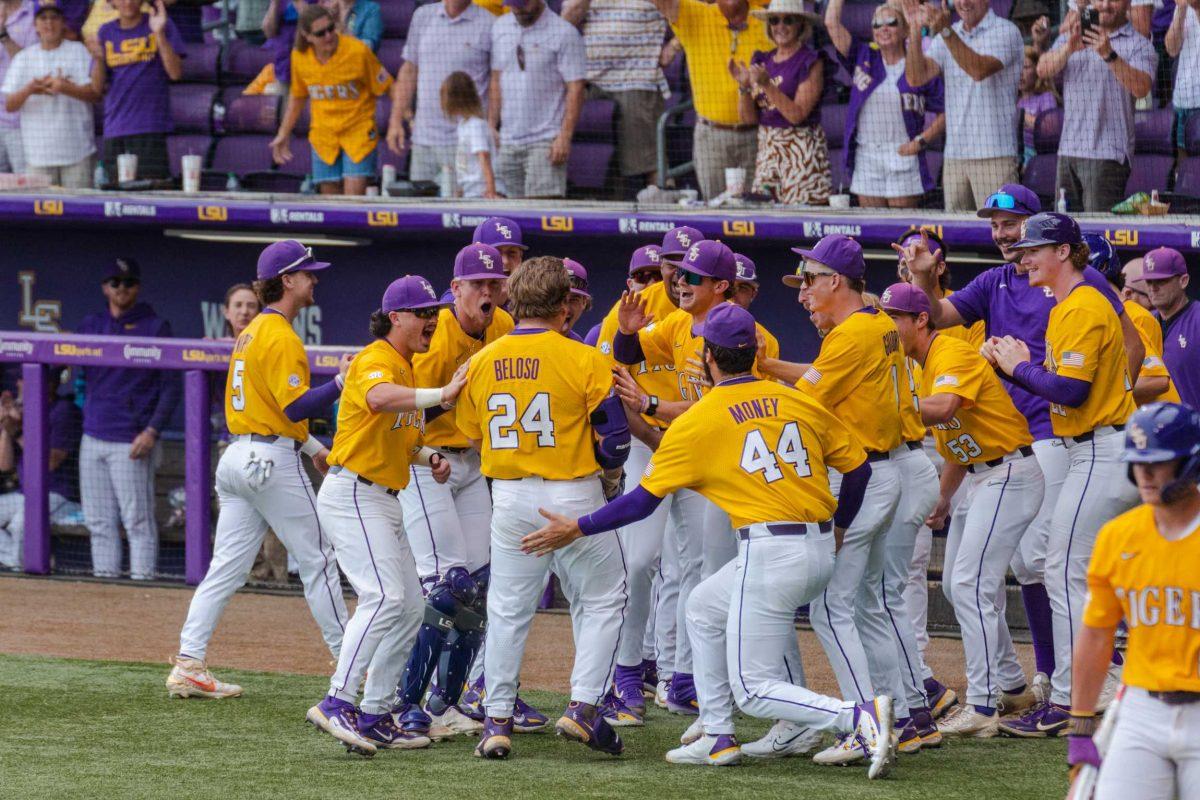 LSU baseball graduate student designated hitter Cade Beloso (24) celebrates a home run with teammates Monday, June 5, 2023, during LSU&#8217;s 13-7 win against Oregon state in Alex Box Stadium in Baton Rouge, La.