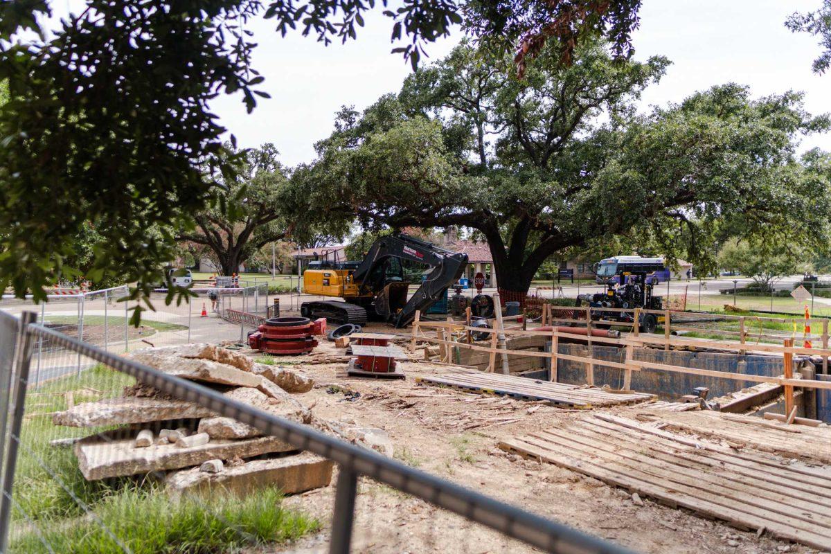 <p>An excavator sits near a large hole on Friday, July 7, 2023, on Tower Drive in Baton Rouge, La.</p>