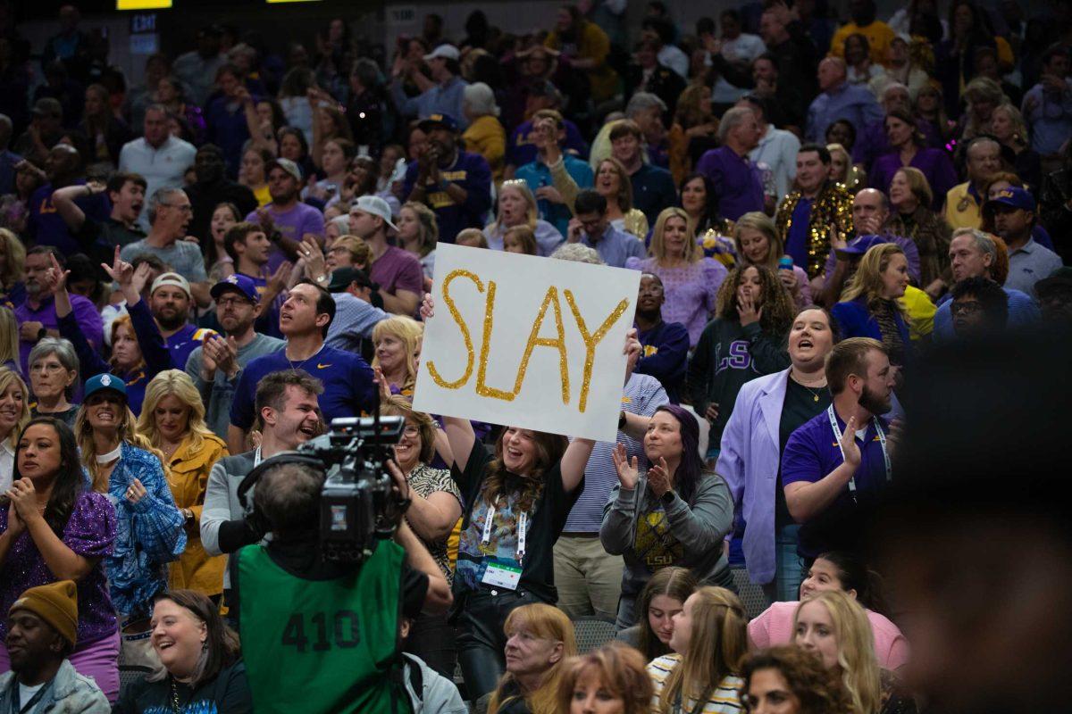 An LSU women&#8217;s basketball fan holds up a sign reading &#8220;SLAY&#8221; on Friday, March 31, 2023, during LSU&#8217;s 79-72 victory over Virginia Tech in the NCAA Final Four in the American Airlines Center in Dallas, Texas.