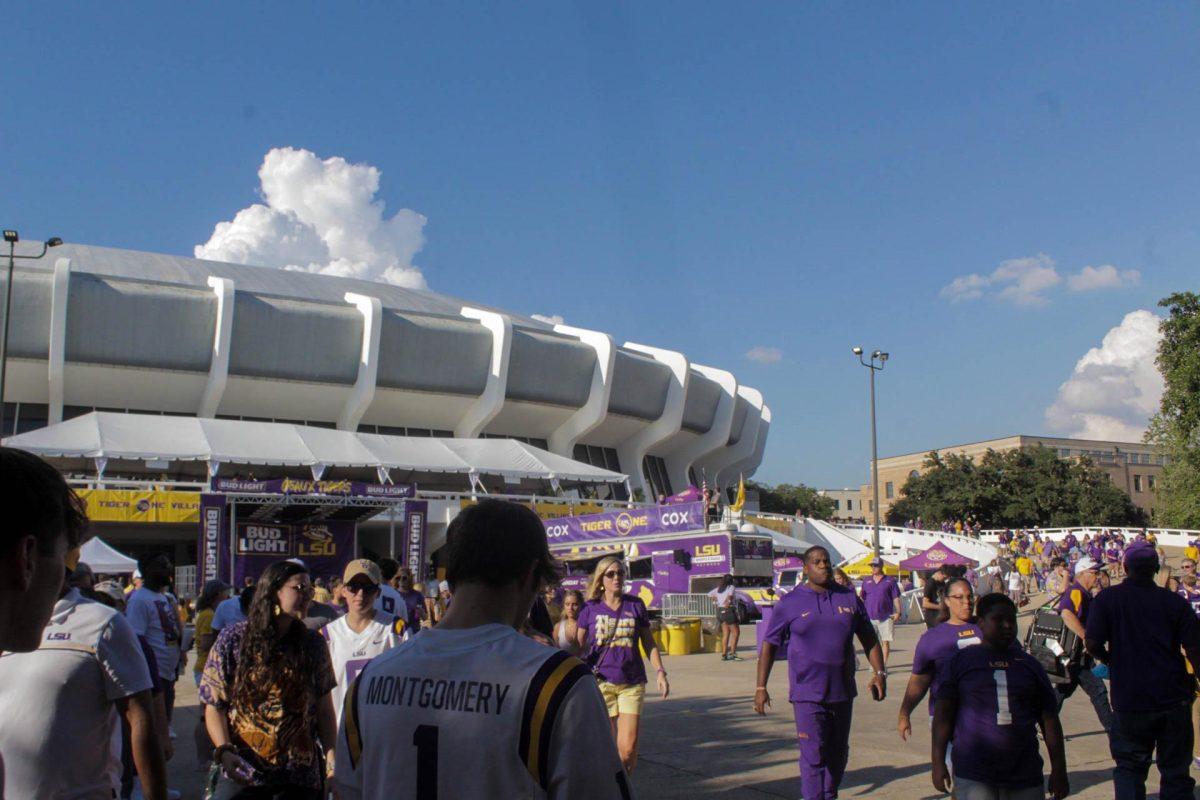 <p>LSU fans enjoy Game Day festivities outside the PMAC on Saturday, Sept. 10, 2022, on N. Stadium Drive, in Baton Rouge, La.</p>