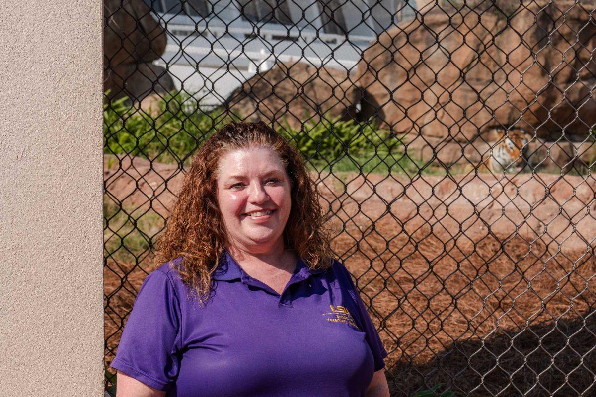 Adjunct instructor at LSU's Manship School of Mass Communication and communications manager for the LSU School of Veterinary Medicine Ginger Guttner stands outside Mike the Tiger's, LSU's live mascot, habitat on Friday, June 23, 2023, on North Stadium Drive in Baton Rouge, La.