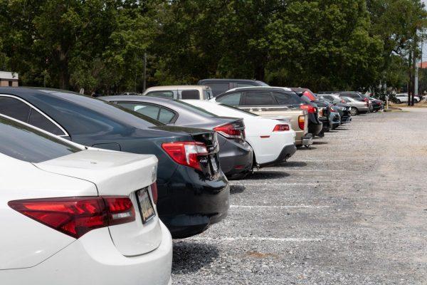 Cars park in a gravel lot Monday, August 28, 2023, newly dedicated to commuter parking off of South Quad Drive on LSU's campus in Baton Rouge, La.