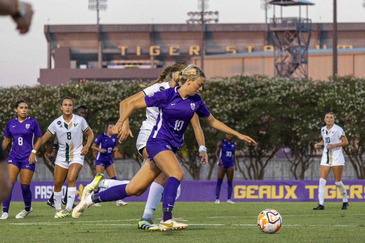 <p>LSU soccer sophomore midfielder Ida Hermannsdottir (10) sprints past USF defenders Thursday, Aug. 17, 2023, during LSU's 1-0 season opener defeat to Southern Florida at the LSU Soccer Stadium.</p>