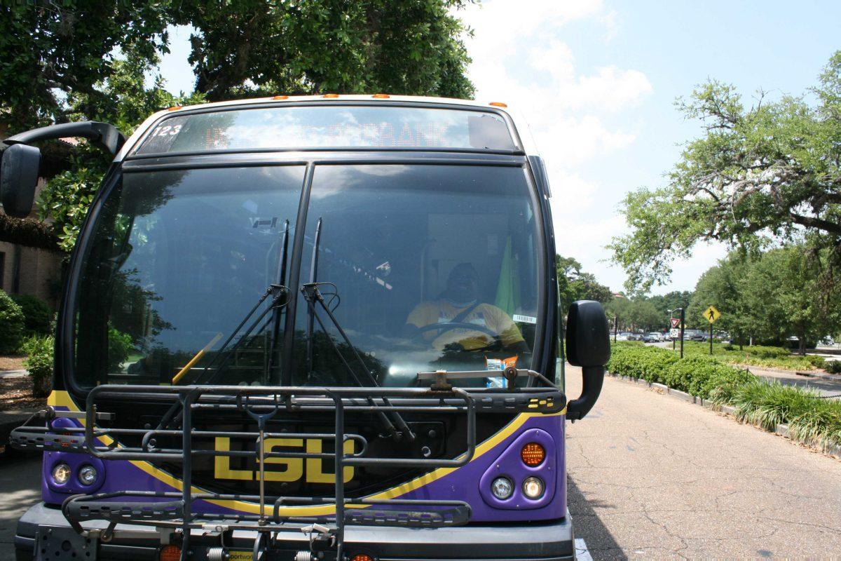 <p>Driver David Alfrod stops his bus beside Hodges Hall on Friday, May 20, 2022.</p>