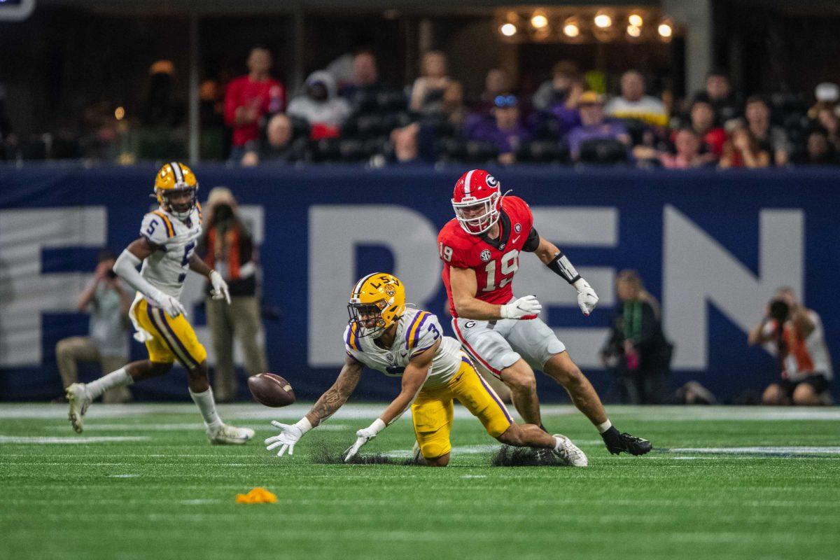 LSU football senior safety Greg Brooks Jr. (3) opens up his arms to intercept a ball intended for Georgia sophomore tight-end Brock Bowers (19) Saturday, Dec. 3, 2022, during LSU's 30-50 defeat to Georgia at the Southeastern Conference Championship at the Mercedes-Benz Stadium in Atlanta, Georgia.