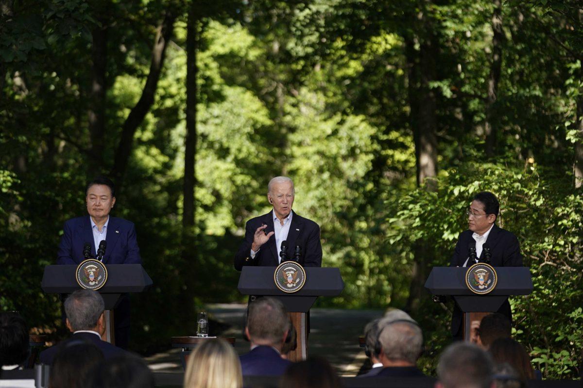 South Korea's President Yoon Suk Yeol, left, and Japan's Prime Minister Fumio Kishida, right, listen as President Joe Biden speaks during a news conference Friday, Aug. 18, 2023, at Camp David, the presidential retreat, near Thurmont, Md. (AP Photo/Andrew Harnik)