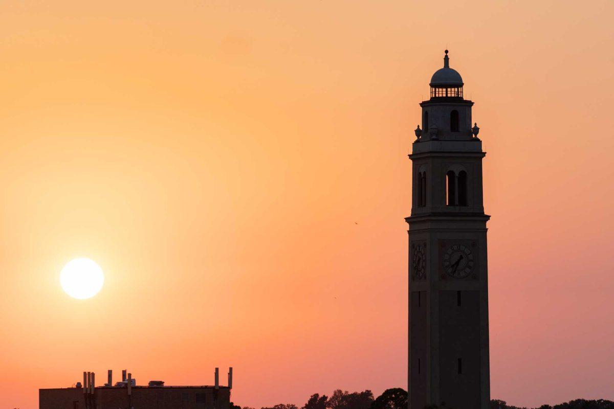 The sun sets behind Memorial Tower on Friday, Aug. 18, 2023, on LSU's campus in Baton Rouge, La.