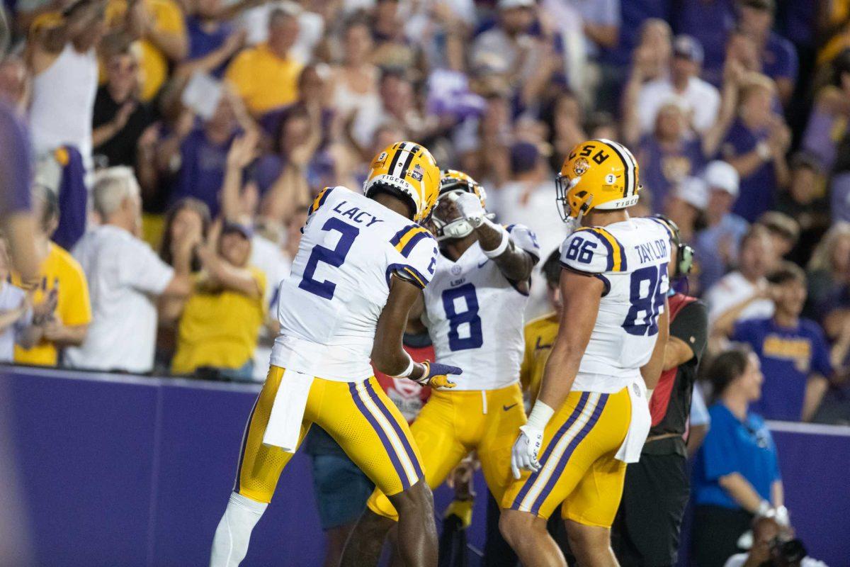 LSU football senior wide receiver Kyren Lacy (2) and junior wide receiver Malik Nabers (8) celebrate after a touchdown Saturday, Sept. 23, 2023, during LSU's 34-31 win against Arkansas at Tiger Stadium in Baton Rouge, La.