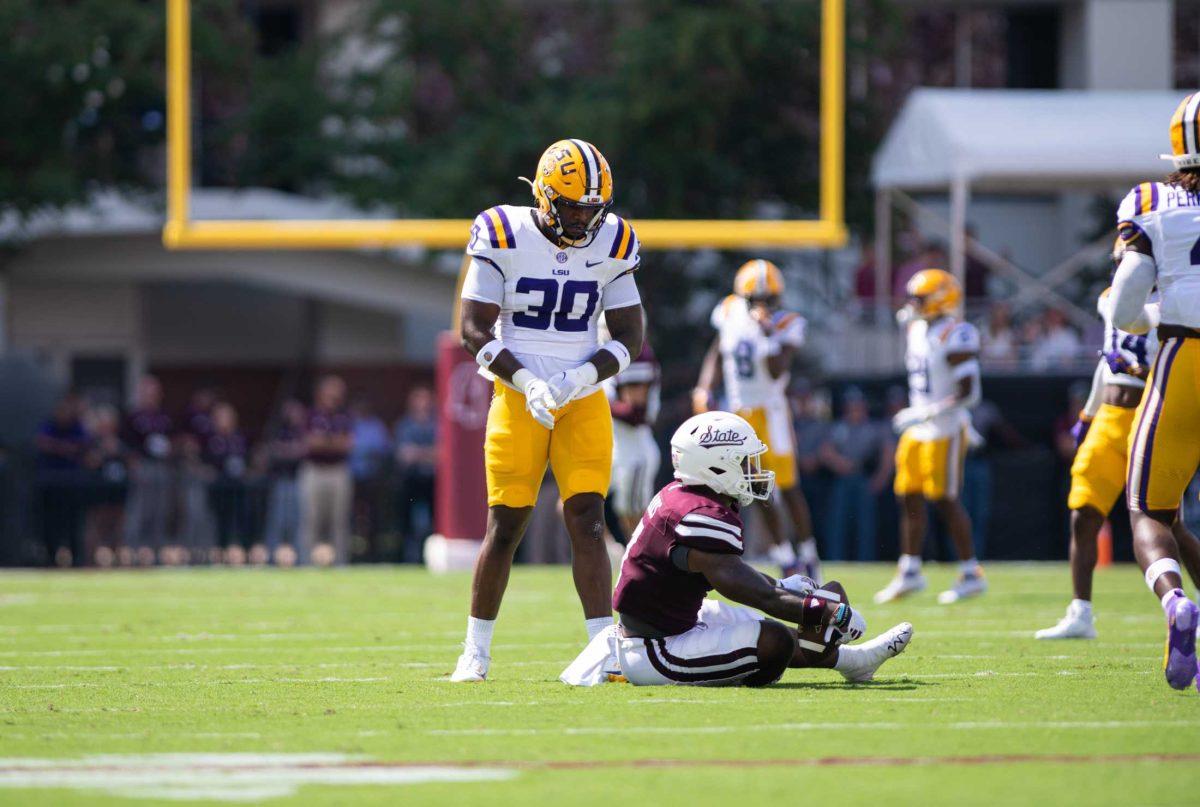 LSU football junior linebacker Greg Penn III (30) stands up after a tackle on Saturday, Sept. 16, 2023, during LSU's 41-14 win over Mississippi State in Davis Wade Stadium in Starkville, MS.