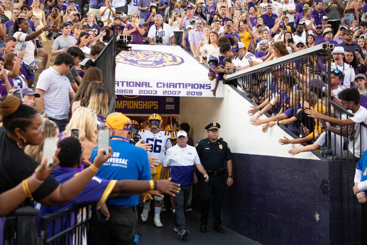 LSU football head coach Brian Kelly and his team walk out of the tunnel on Saturday, Sept. 9, 2023, before LSU&#8217;s 72-10 win over Grambling State at Tiger Stadium in Baton Rouge, La.