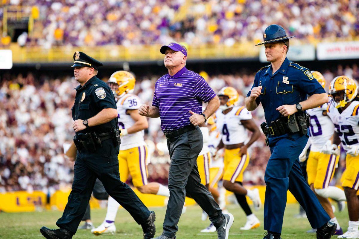 LSU football head coach Brian Kelly runs off the field for halftime Saturday, Sept. 17, 2022 before LSU&#8217;s 31-16 win against Mississippi State at Tiger Stadium in Baton Rouge, La.