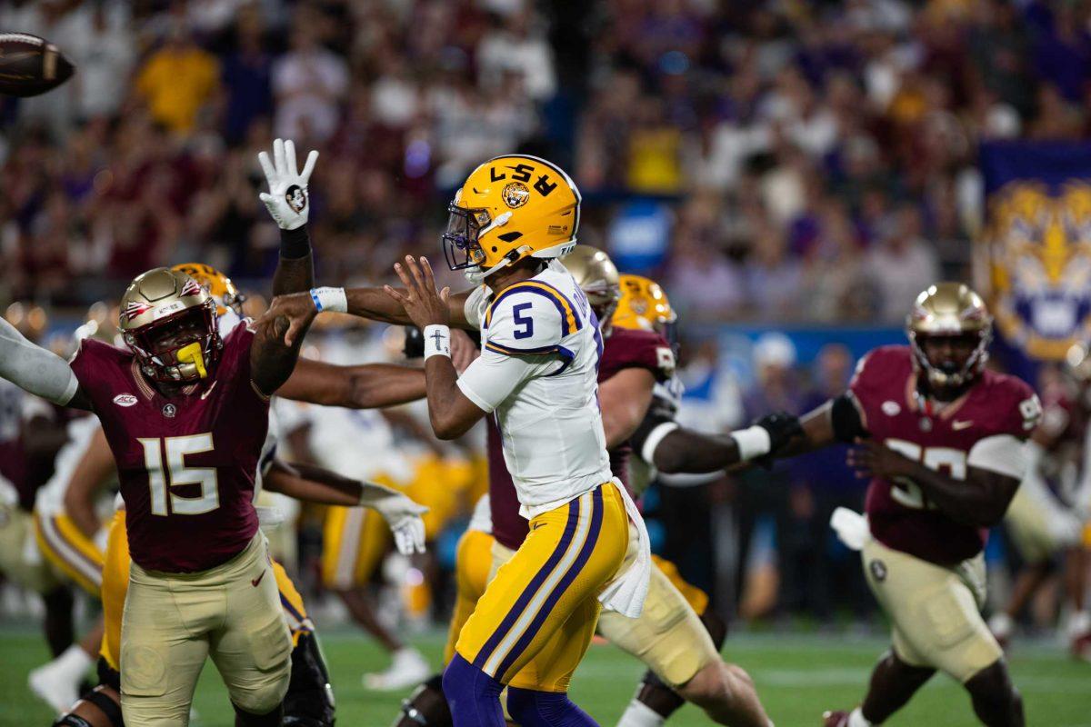 LSU football senior quarterback Jayden Daniels (5) throws the ball on Sunday, Sept. 3, 2023, during LSU&#8217;s 45-24 loss to Florida State at Camping World Stadium in Orlando, Fl.