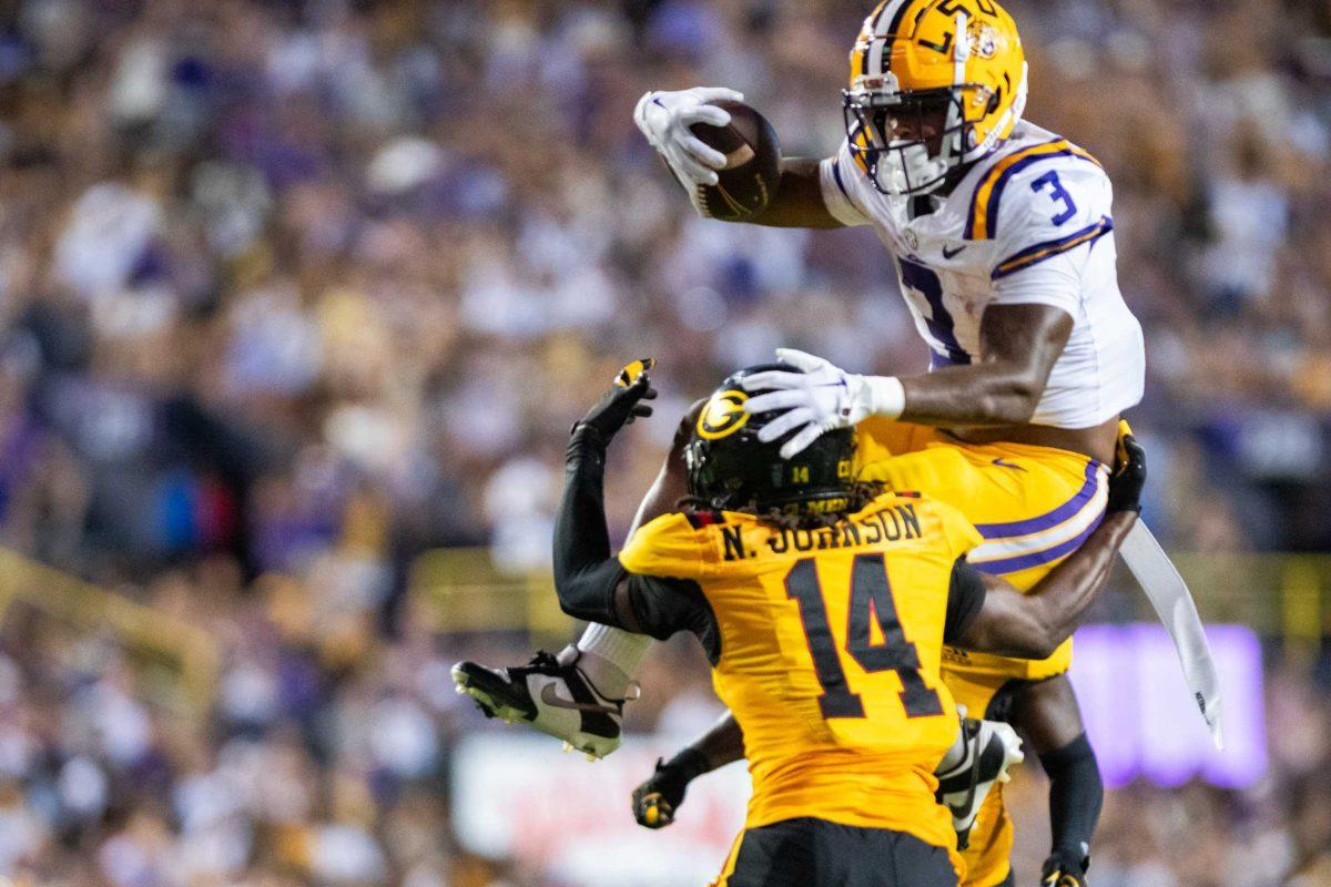 LSU football junior running back Logan Diggs (3) attempts to jump over Grambling defensive back Norey Johnson (14) on Saturday, Sept. 9, 2023, during LSU&#8217;s 72-10 win over Grambling State at Tiger Stadium in Baton Rouge, La.