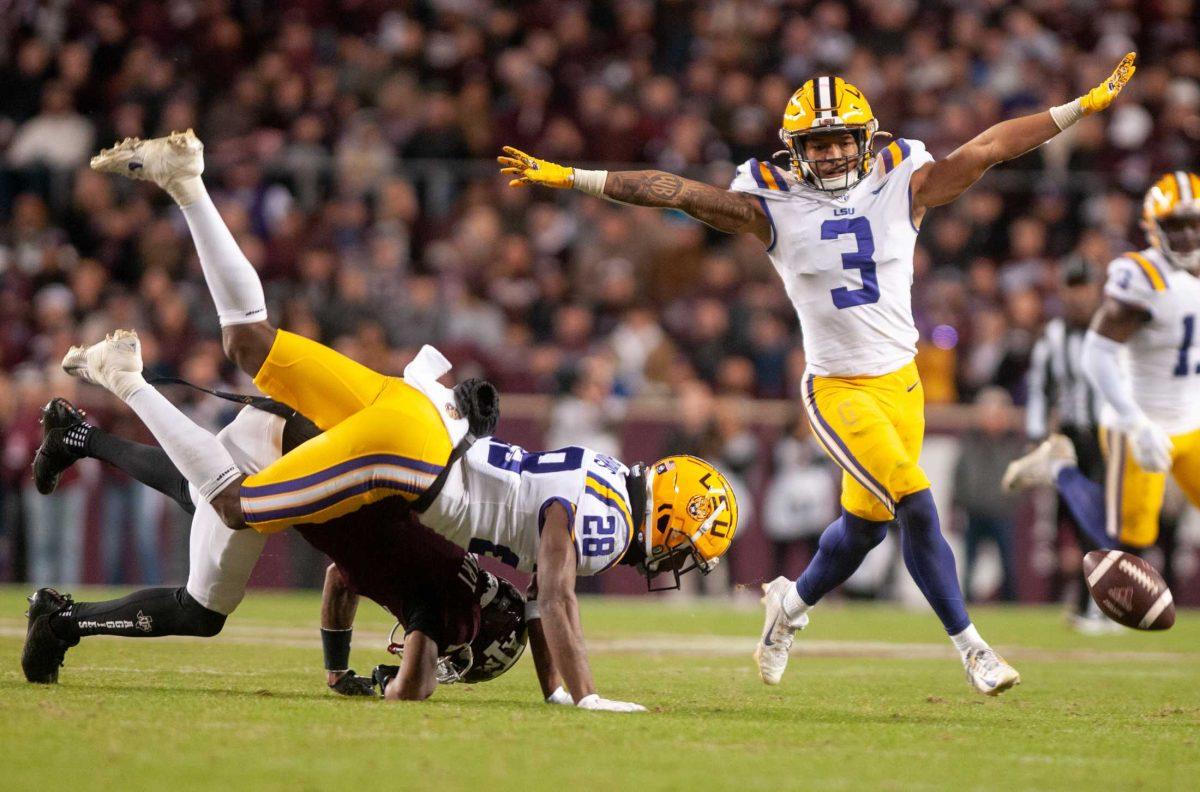 LSU football senior safety Greg Brooks Jr. signals the pass as incomplete on Saturday, Nov. 26, 2022, during LSU's 23-38 loss against Texas A&amp;M at Kyle Field.