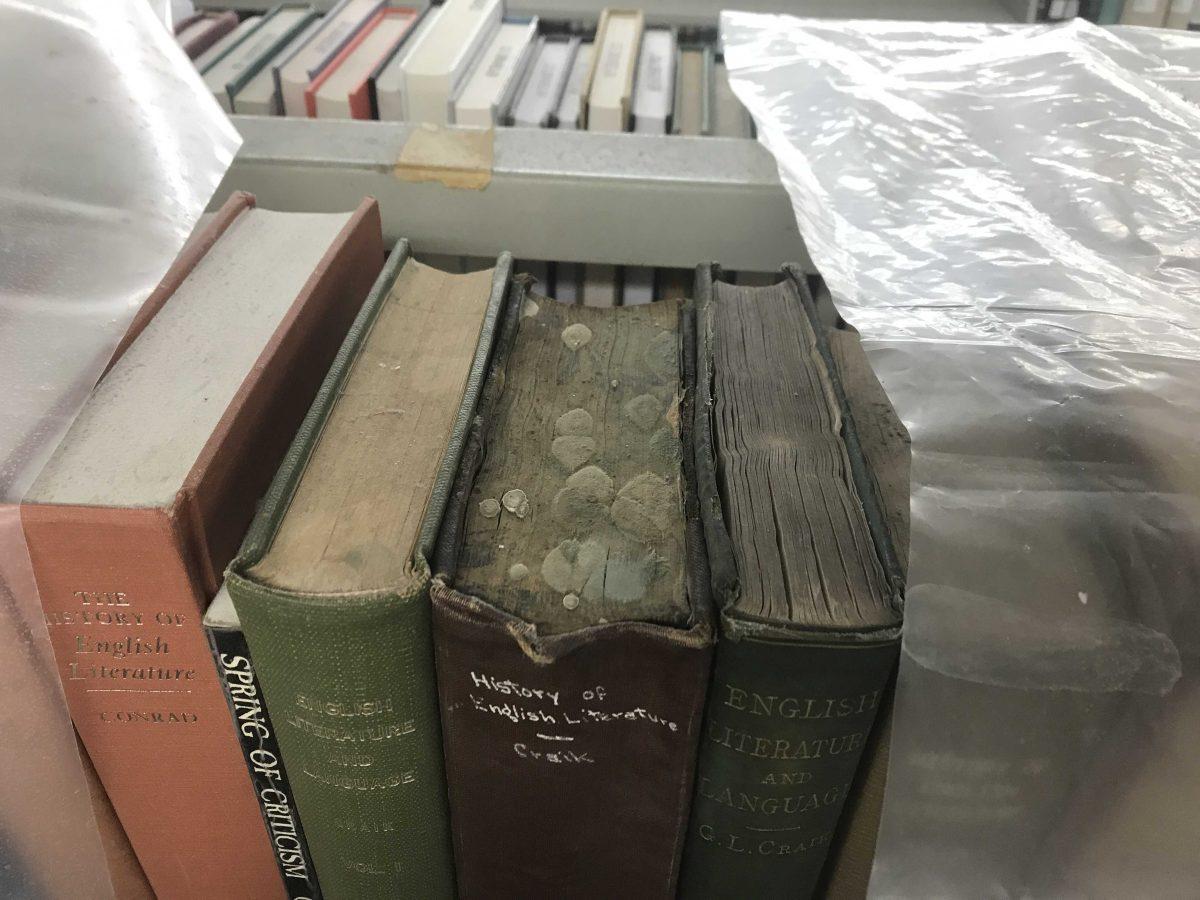 Molding books sit covered in a layer of plastic Jan. 18, 2022, in the LSU Library.