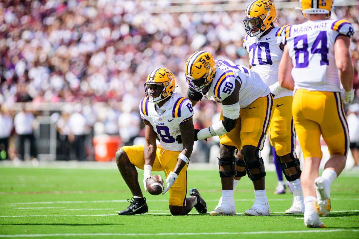 LSU football junior wide receiver Malik Nabers (8) is lifted up by his teammate LSU Football sophomore right tackle Emery Jones Jr. (50) on Saturday, Sept. 16, 2023, during LSU's 41-14 win over Mississippi State in Davis Wade Stadium in Starkville, MS.