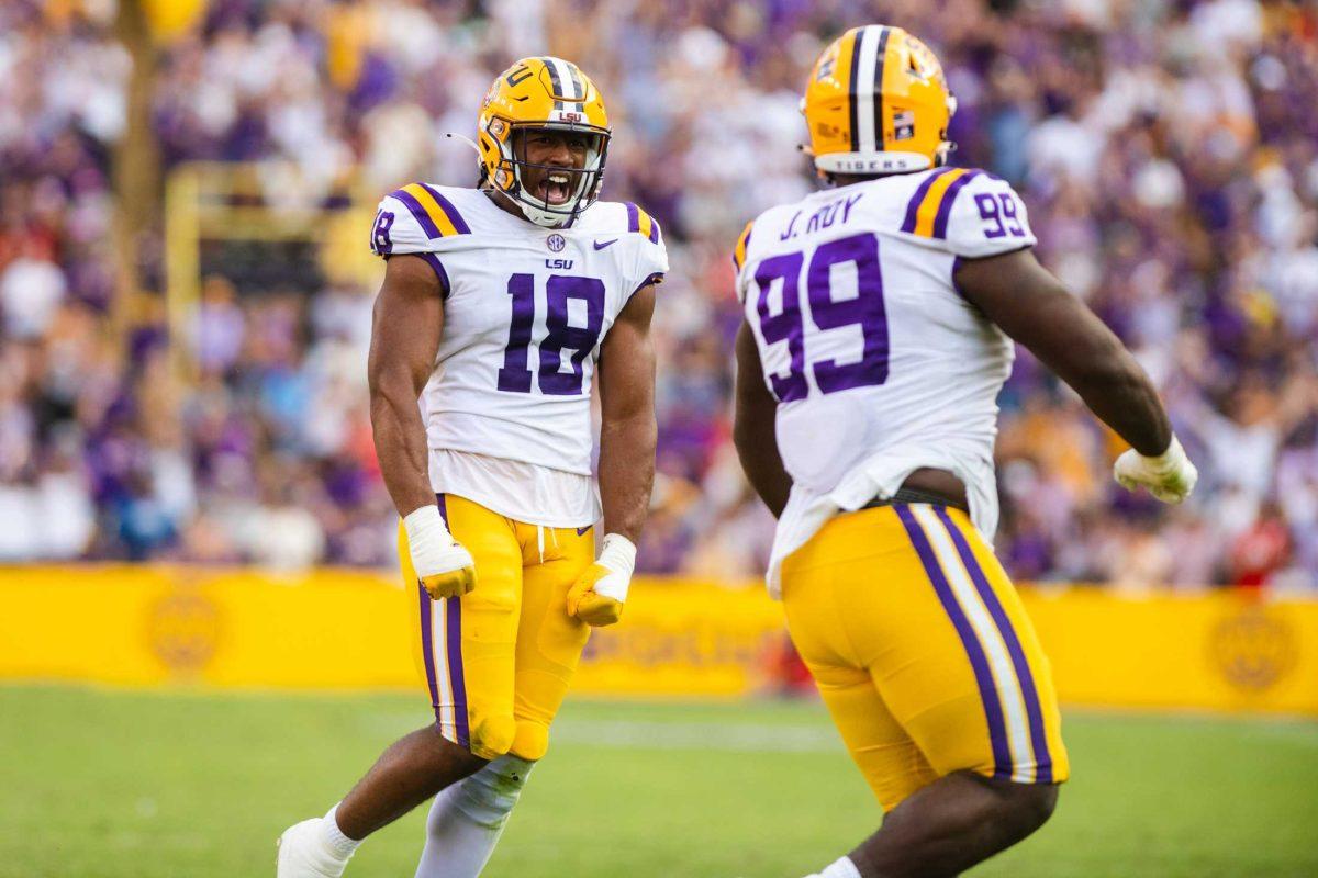 LSU football junior defensive end BJ Ojulari (18) celebrates after a fourth down defensive stop Saturday, Oct. 22, 2022, during LSU&#8217;s 45-20 win against Ole Miss at Tiger Stadium in Baton Rouge, La.