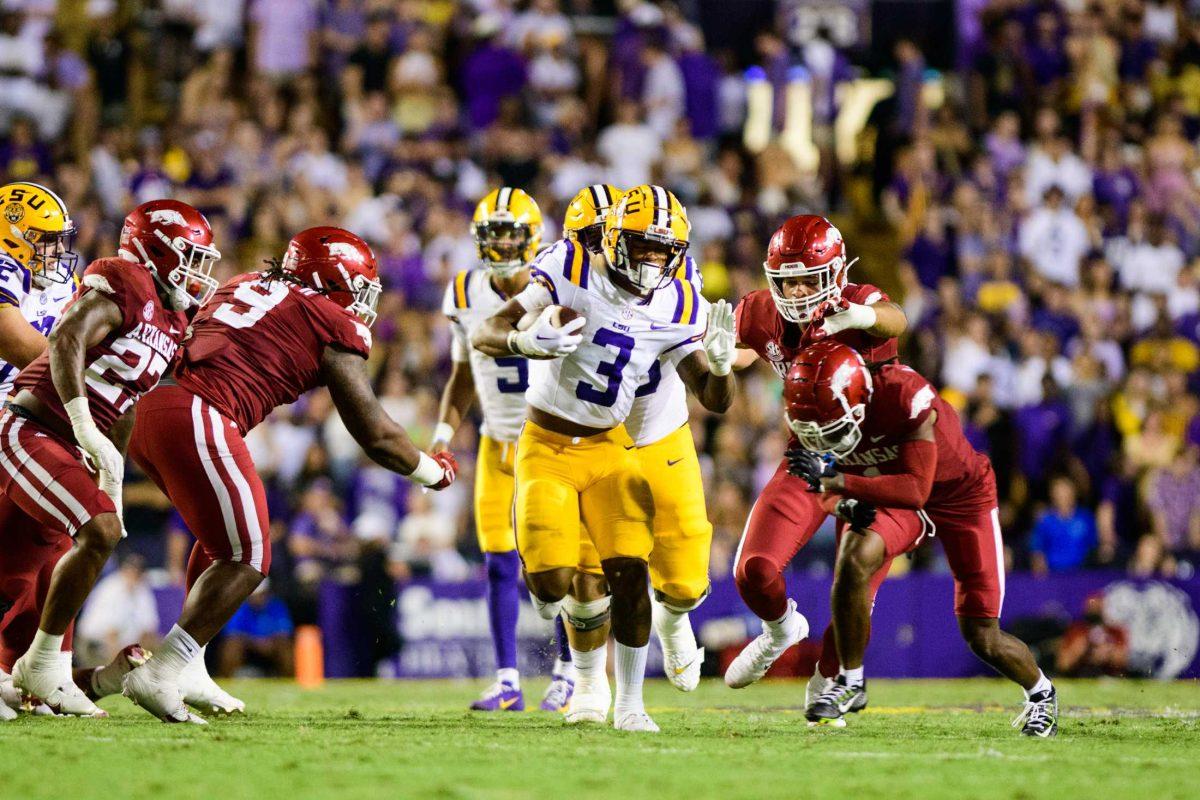 LSU football junior running back Logan Diggs (3) sprints down the field on Saturday, Sept. 23, 2023, during LSU's 34-31 victory over Arkansas in Death Valley in Baton Rouge, La.