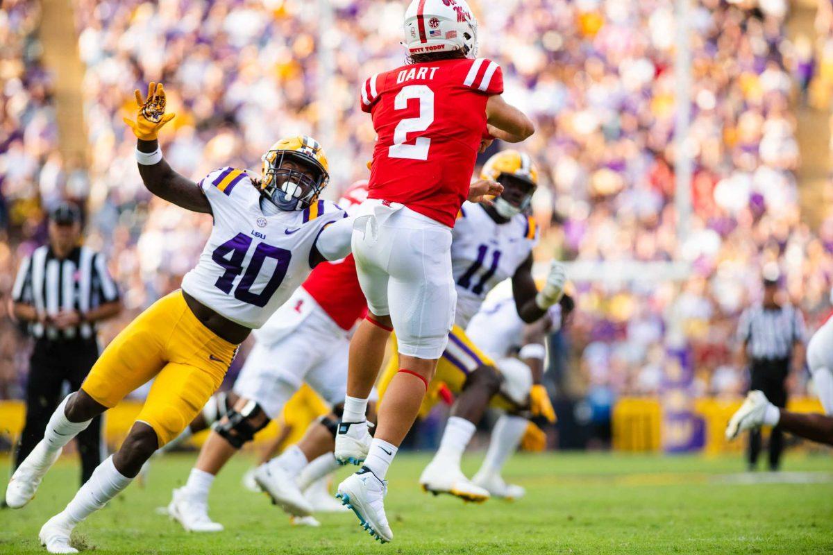 LSU football freshman linebacker Harold Perkins Jr. (40) pressures Ole Miss football sophomore quarterback Jaxson Dart (2) Saturday, Oct. 22, 2022, during LSU&#8217;s 45-20 win against Ole Miss at Tiger Stadium in Baton Rouge, La.