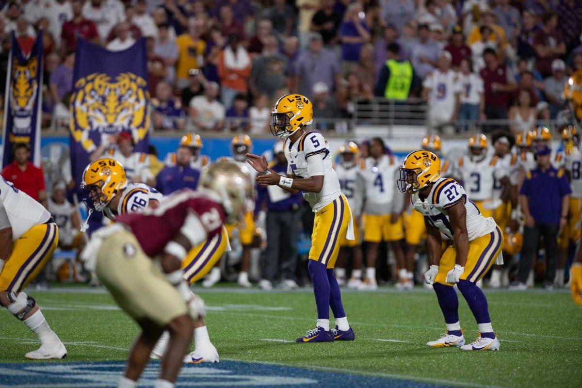 LSU football senior quarterback Jayden Daniels (5) prepares to take a snap on Sunday, Sept. 3, 2023, during LSU&#8217;s 45-24 loss to Florida State at Camping World Stadium in Orlando, Fl.