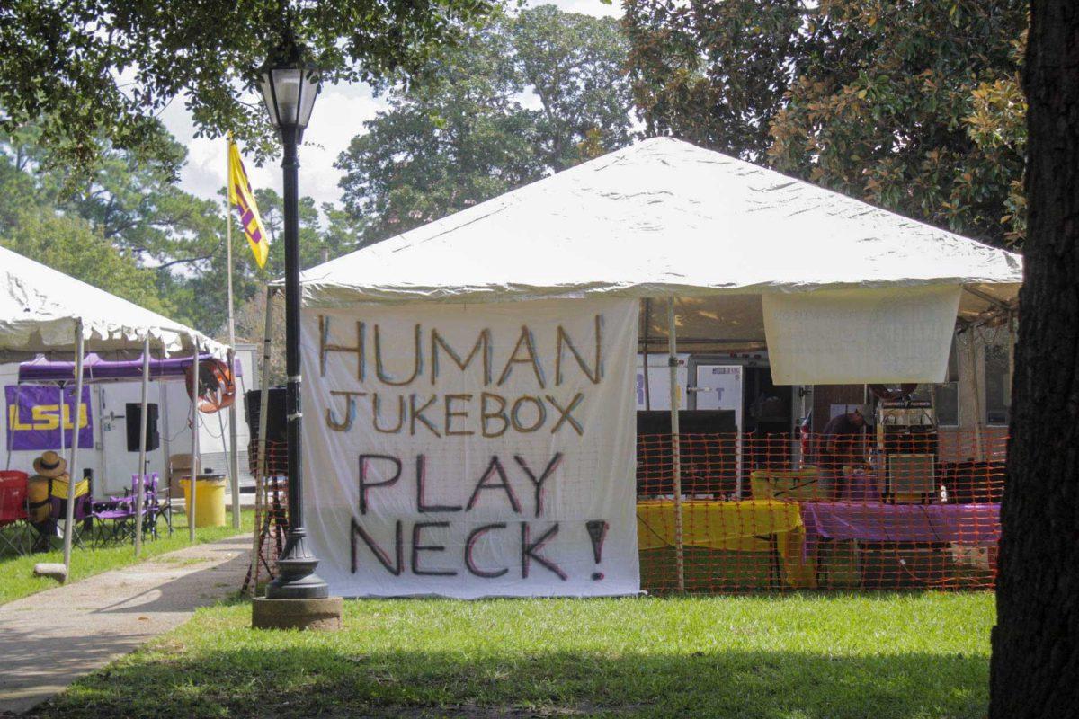 A fan's tailgating tent and sign sits near the Indian Mounds on Saturday, Sept. 10, 2022, on LSU campus, in Baton Rouge, La.