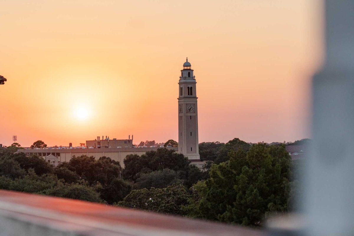 The sun sets behind Memorial Tower on Friday, Aug. 18, 2023, on LSU's campus in Baton Rouge, La.