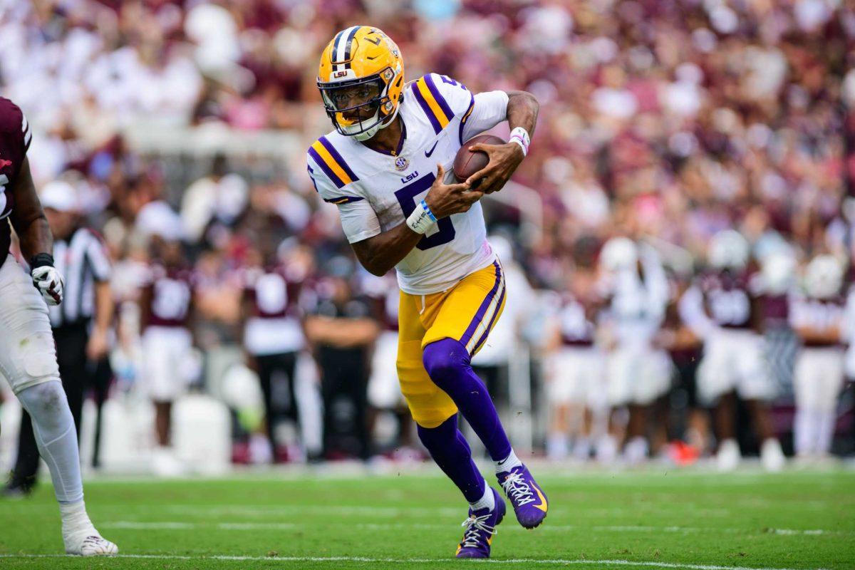 LSU football senior quarterback Jayden Daniels (5) runs the ball on Saturday, Sept. 16, 2023, during LSU's 41-14 win over Mississippi State in Davis Wade Stadium in Starkville, MS.