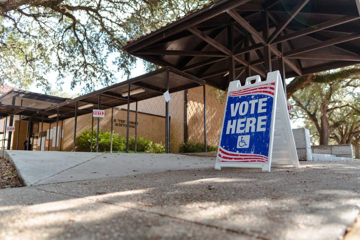 A sign reads &#8220;Vote Here&#8221; on Tuesday, Nov. 8, 2022, outside of the LSU Laboratory School on East Campus Drive in Baton Rouge, La.