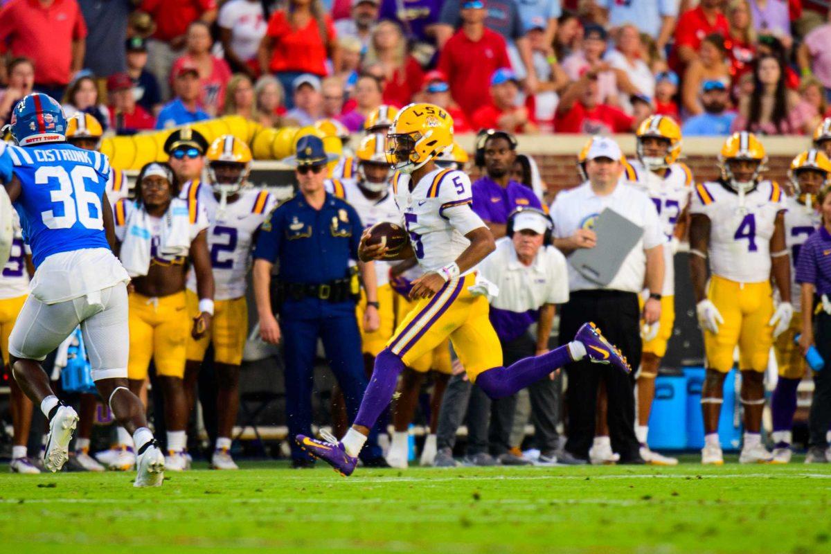 LSU football senior quarterback Jayden Daniels (5) rushes down the field on Saturday, Sept. 30, 2023, during LSU's 55-49 loss against Ole Miss in Vaught Hemingway Stadium in Oxford, Miss.