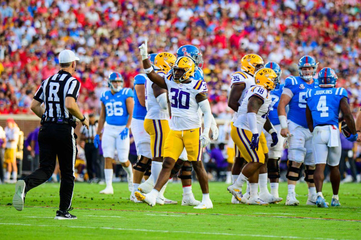 LSU football junior linebacker Greg Penn III (30) celebrates a stop on Saturday, Sept. 30, 2023, during LSU's 55-49 loss against Ole Miss in Vaught Hemingway Stadium in Oxford, Miss.