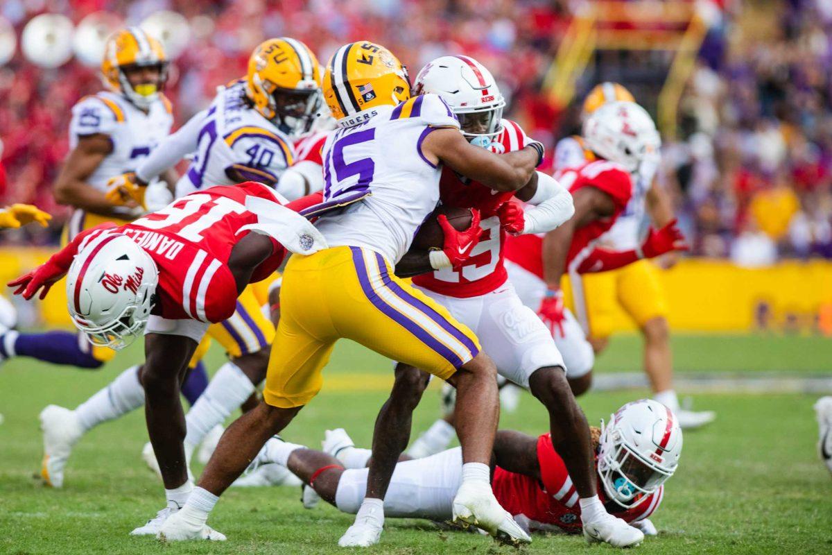 LSU football redshirt safety Sage Ryan (15) tackles an Ole Miss player Saturday, Oct. 22, 2022, during LSU&#8217;s 45-20 win against Ole Miss at Tiger Stadium in Baton Rouge, La.