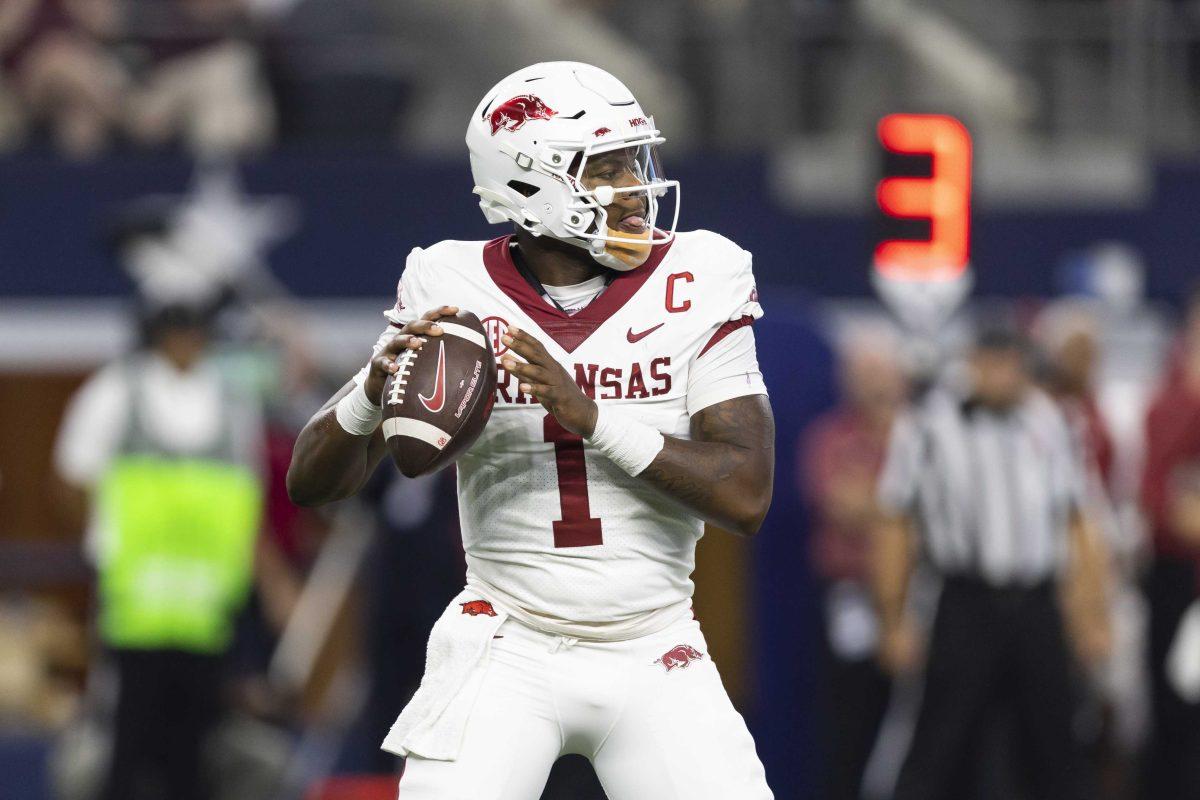 Arkansas quarterback KJ Jefferson (1) looks for an open receiver during the first half of the team's NCAA college football game against Texas A&amp;M on Saturday, Sept. 24, 2022, in Arlington, Texas. (AP Photo/Brandon Wade)