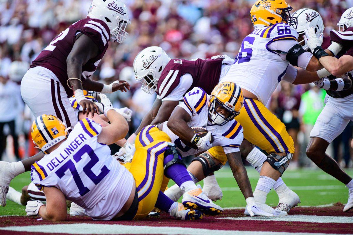 LSU football junior running back Logan Diggs (3) pushes through to the end zone on Saturday, Sept. 16, 2023, during LSU's 41-14 win over Mississippi State in Davis Wade Stadium in Starkville, MS.