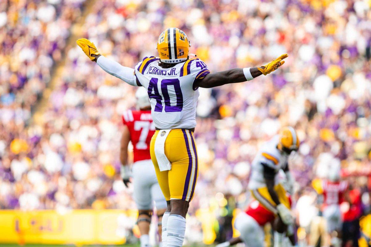 LSU football freshman linebacker Harold Perkins Jr. (40) celebrates after a defensive stop Saturday, Oct. 22, 2022, during LSU&#8217;s 45-20 win against Ole Miss at Tiger Stadium in Baton Rouge, La.