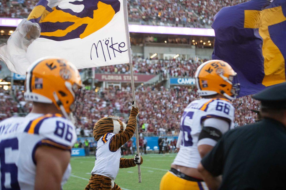 Mike the Tiger runs out with the LSU football team on Sunday, Sept. 3, 2023, before LSU&#8217;s 45-24 loss to Florida State at Camping World Stadium in Orlando, Fl.