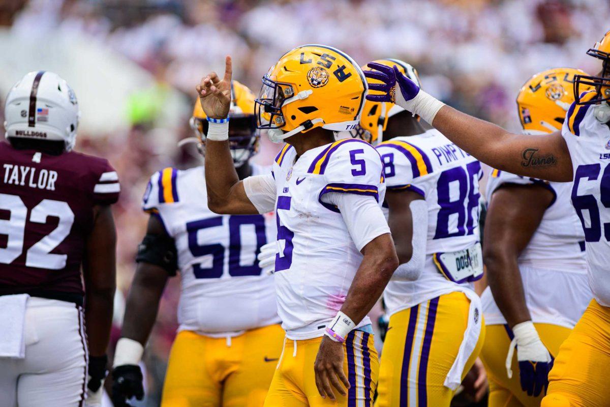 LSU football senior quarterback Jayden Daniels (5) celebrates a touchdown on Saturday, Sept. 16, 2023, during LSU's 41-14 win over Mississippi State in Davis Wade Stadium in Starkville, MS.