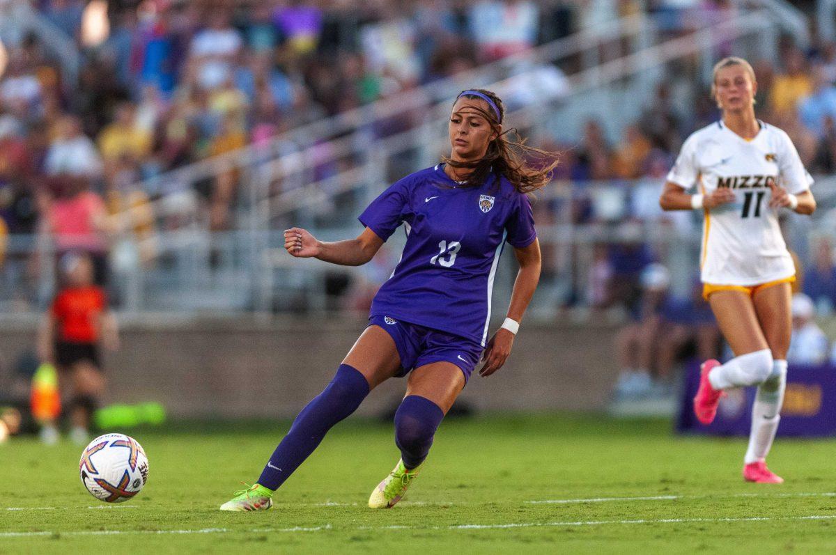 <p>LSU soccer redshirt junior forward Taylor Dobles (13) passes the ball Thursday, Sept. 22, 2022, during LSU's 2-1 win against University of Missouri at LSU's Soccer Stadium off Nicholson Drive.</p>