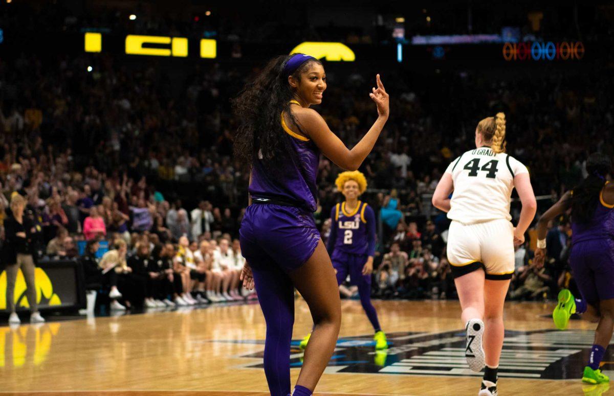 LSU women&#8217;s basketball sophomore forward Angel Reese (10) holds up three fingers on Sunday, April 2, 2023, during LSU's 102-85 win against Iowa in the NCAA National Championship in the American Airlines Center in Dallas, Texas.