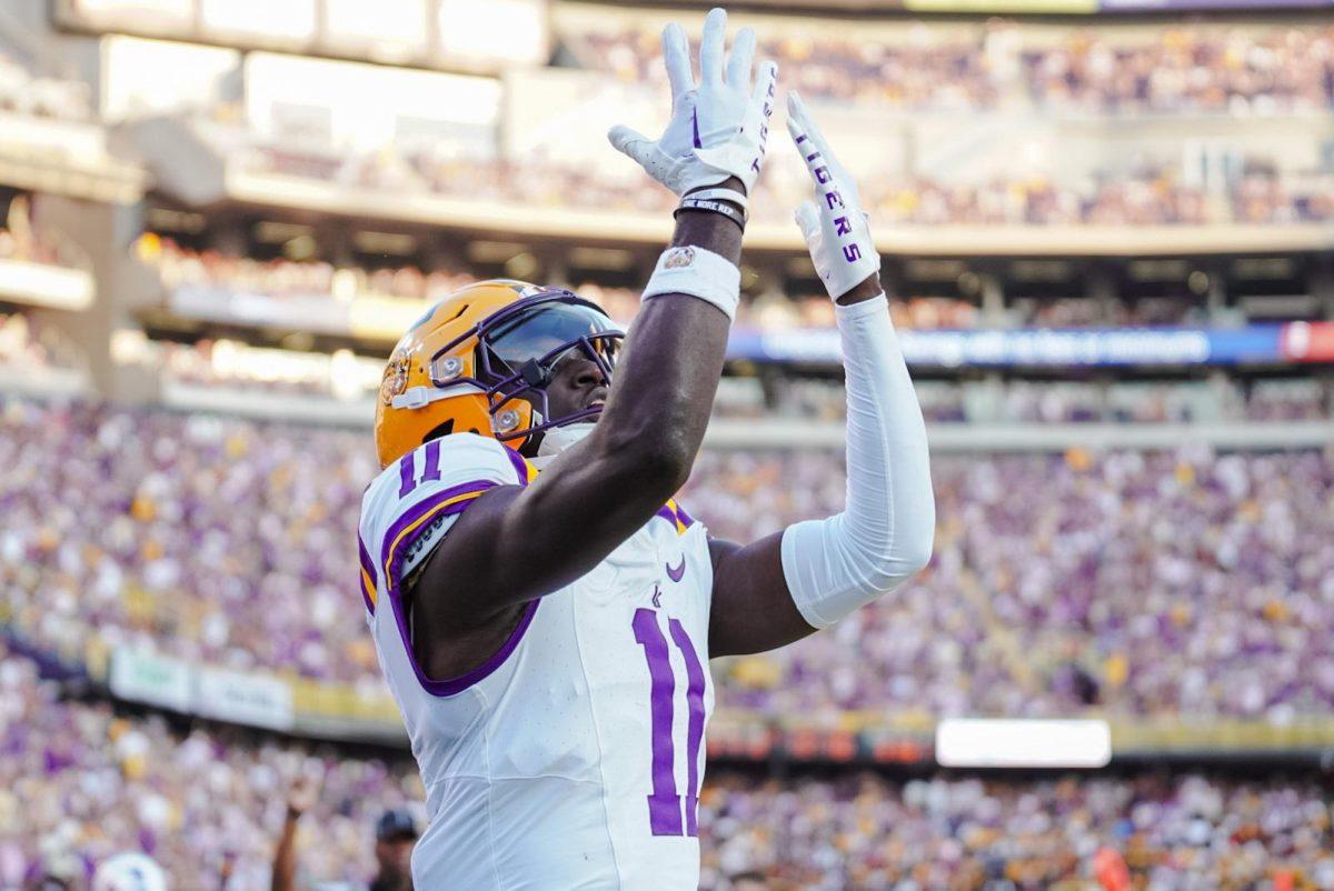 LSU football junior wide receiver Brian Thomas Jr. (11) celebrates a touchdown on Saturday, Sept. 9, 2023, during LSU&#8217;s 72-10 win against Grambling in Tiger Stadium in Baton Rouge, La.