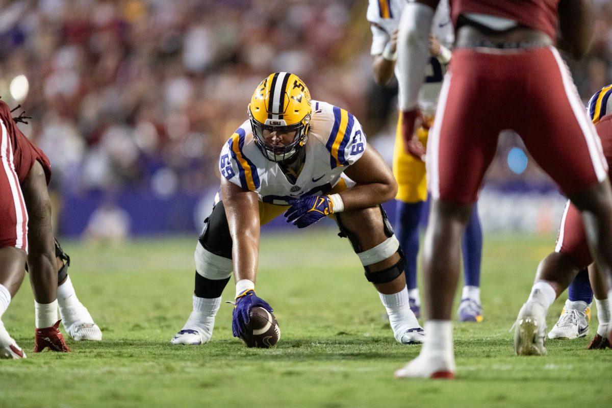 LSU football 5-th year senior center Charles Turner III (69) prepares to hike the ball Saturday, Sept. 23, 2023, during LSU's 34-31 win against Arkansas at Tiger Stadium in Baton Rouge, La.