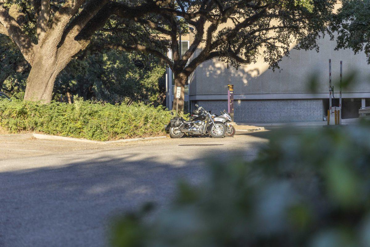 Motorcycles sit in their designated parking area Monday, Oct. 16, 2023, near Coates Hall.