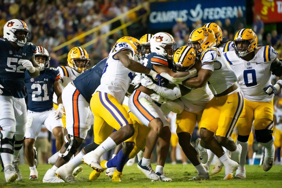 LSU football players engage the Auburn players during the 48-18 LSU win vs. Auburn on Saturday, Oct. 14, 2023, at the LSU Tiger Stadium in Baton Rouge, La.