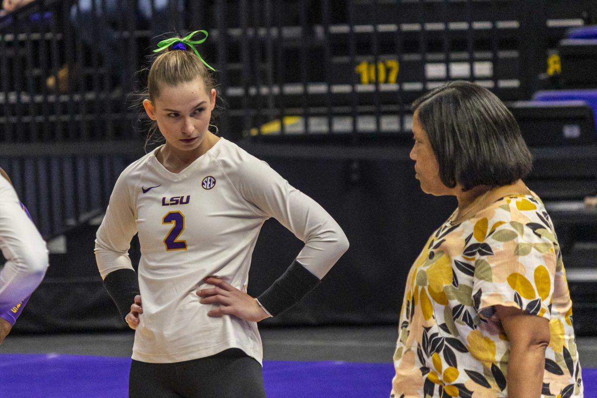 LSU volleyball senior outside hitter Paige Flickinger (2) takes in last minute comments from head coach Tonya Johnson Wednesday, Oct. 4, 2023, prior to LSU's 3-0 loss to Arkansas at the Pete Maravich Assembly Center in Baton Rouge, La.