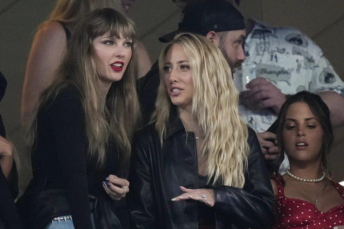 <p>Taylor Swift, left, and Brittany Mahomes, center, watch play between the New York Jets and Kansas City Chiefs at an NFL football game.</p>