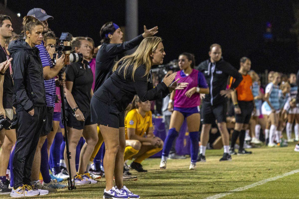 LSU soccer head coach Sian Hudson claps on her team Thursday, Oct. 26, 2023, during LSU's 0-0 draw to Texas A&amp;M at the LSU Soccer Stadium.