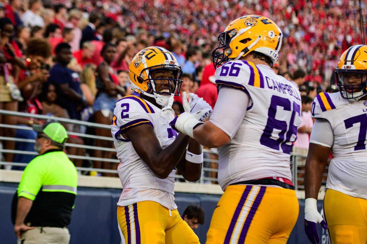 LSU football senior wide receiver Kyren Lacy (2) celebrates with LSU football sophomore left tackle Will Campbell (66) after a touchdown on Saturday, Sept. 30, 2023, during LSU's 55-49 loss against Ole Miss in Vaught-Hemingway Stadium in Oxford, Miss.